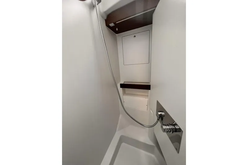  Yacht Photos Pics Shower area in 2023 Beneteau Oceanis 51.1 yacht, featuring modern fixtures and sleek design.