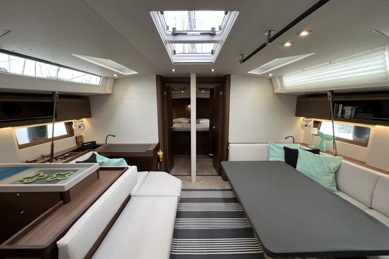  Yacht Photos Pics Luxurious interior of 2023 Beneteau Oceanis 51.1 yacht, featuring modern seating and elegant design.