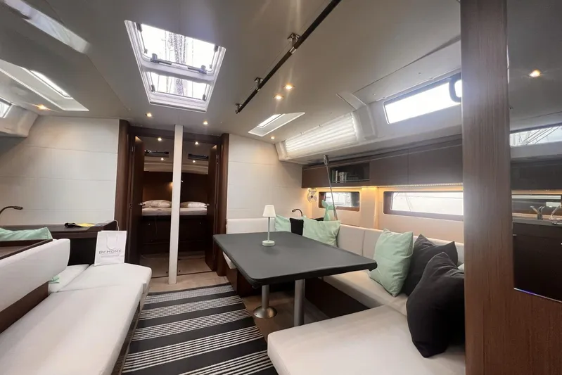  Yacht Photos Pics Luxurious interior of 2023 Beneteau Oceanis 51.1 yacht with modern seating and dining area.