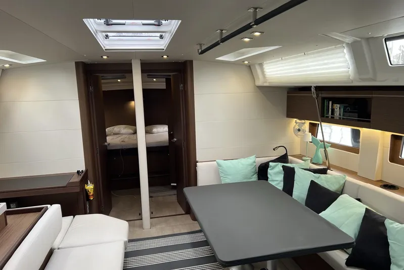  Yacht Photos Pics Luxurious interior of 2023 Beneteau Oceanis 51.1 yacht with modern seating and elegant design.