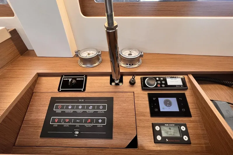  Yacht Photos Pics Control panel of 2023 Beneteau Oceanis 51.1 yacht with navigation and power management systems.