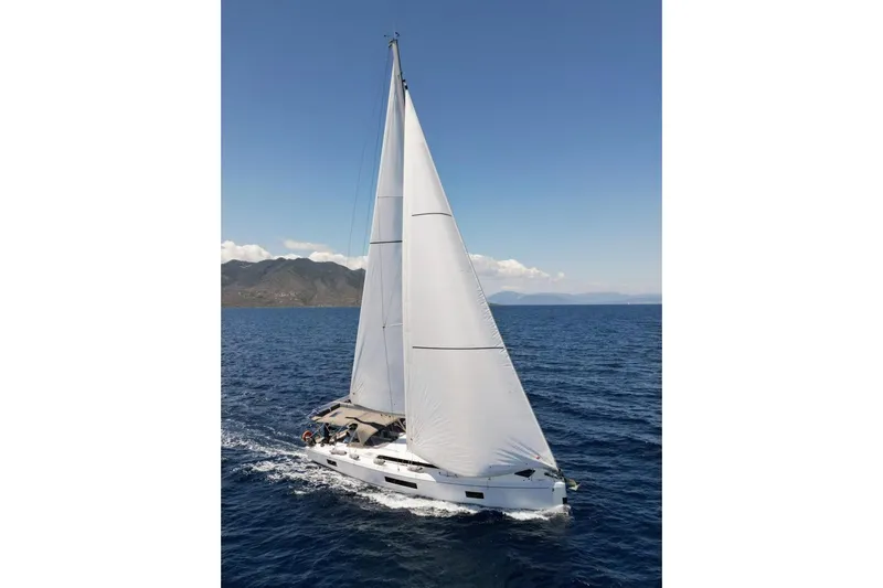  Yacht Photos Pics 2023 Beneteau Oceanis 51.1 sailing on open sea under clear blue sky.