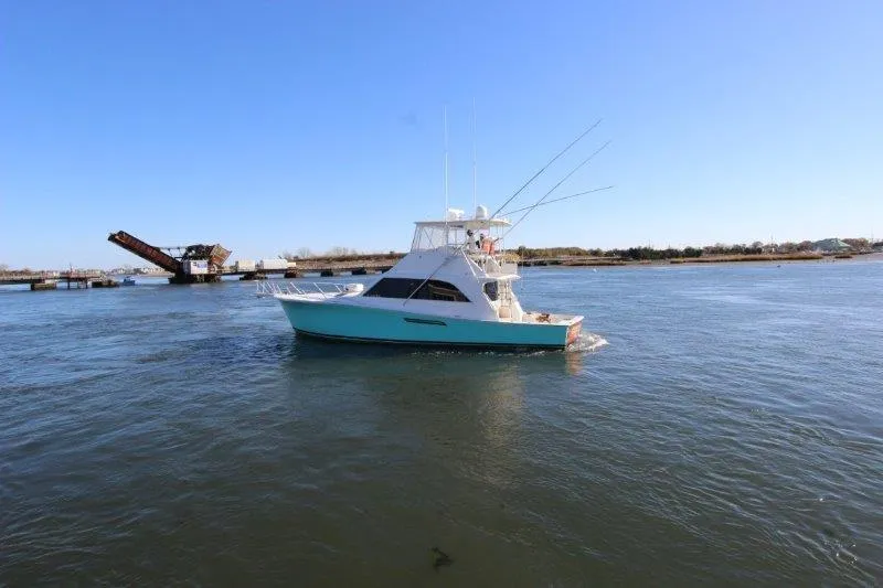  Yacht Photos Pics 1990 Ocean Yachts 48 Super Sport cruising on open water.