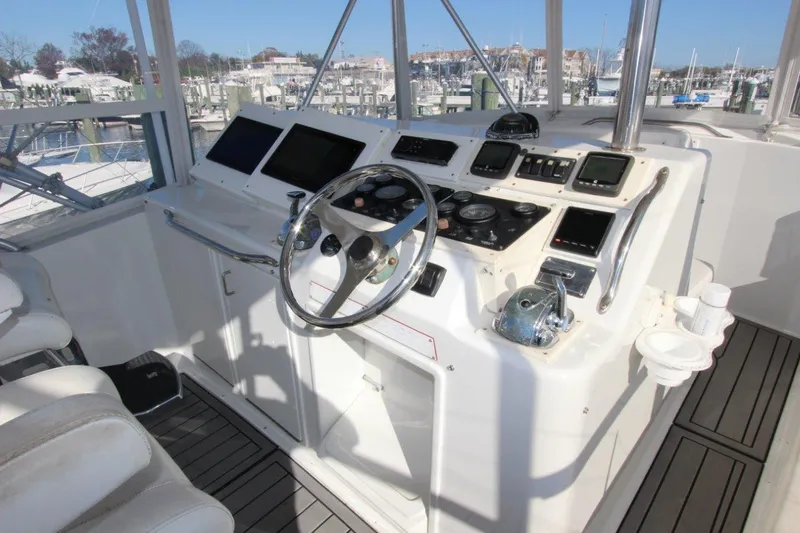  Yacht Photos Pics Cockpit of 1990 Ocean Yachts 48 Super Sport with modern navigation equipment.