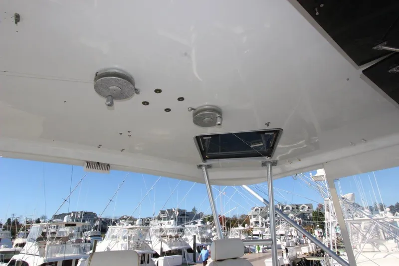  Yacht Photos Pics 1990 Ocean Yachts 48 Super Sport flybridge ceiling with hatch and marina view.