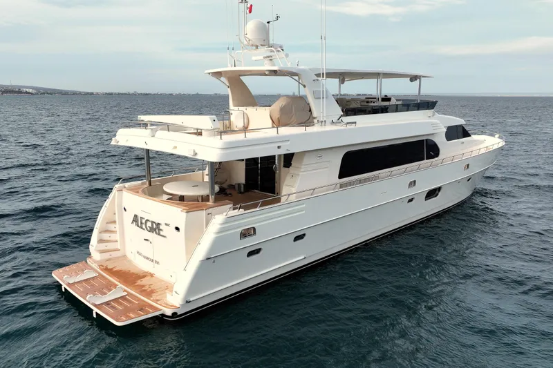 Alegre Yacht Photos Pics Luxurious 2004 Symbol M.S Super 88 Motoryacht cruising on open water.