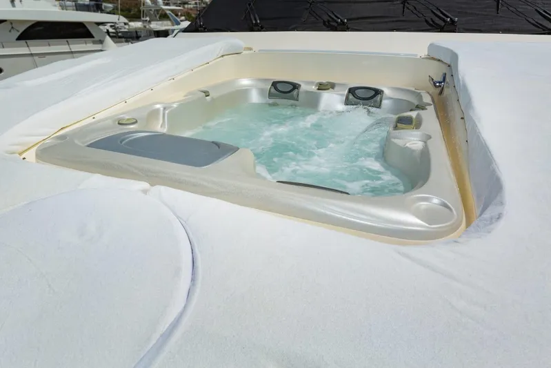 Alegre Yacht Photos Pics Hot tub on 2004 Symbol M.S Super 88 Motoryacht, surrounded by white cover.