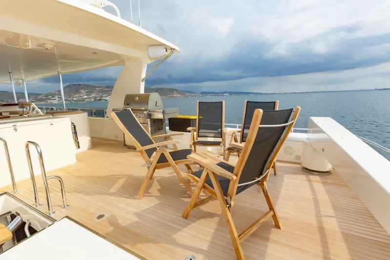 Alegre Yacht Photos Pics Luxury deck of 2004 Symbol M.S Super 88 Motoryacht with chairs and ocean view.