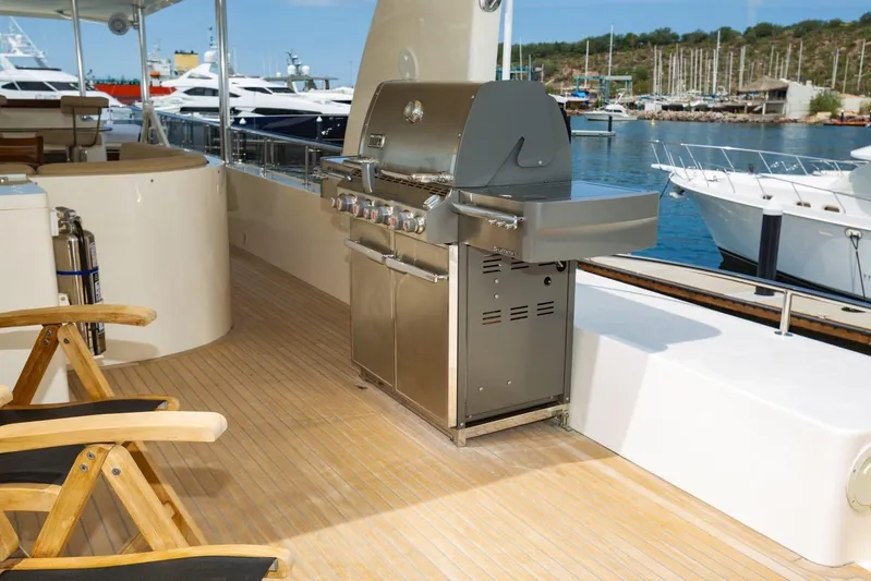 Alegre Yacht Photos Pics Luxurious deck of 2004 Symbol M.S Super 88 Motoryacht with grill and seating area.