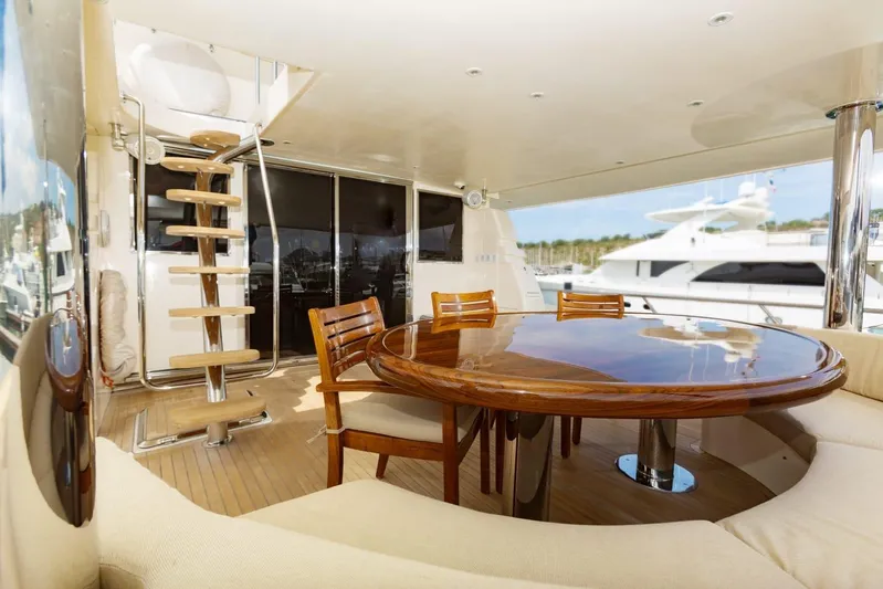 Alegre Yacht Photos Pics Luxurious 2004 Symbol M.S Super 88 Motoryacht deck with elegant dining area.