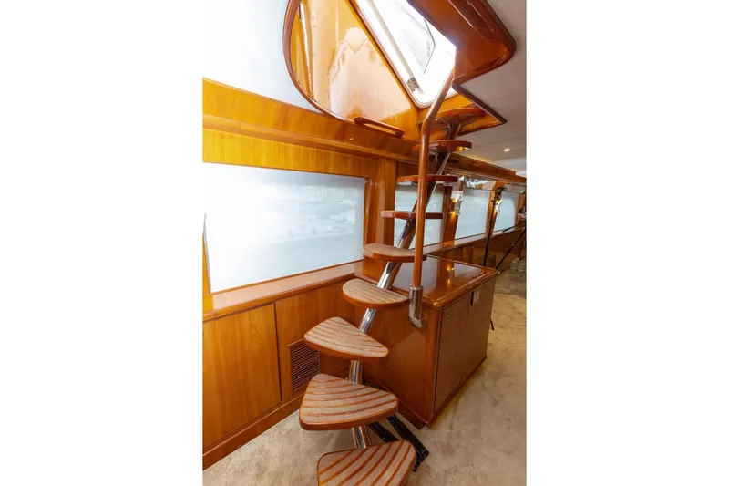 Alegre Yacht Photos Pics Interior of 2004 Symbol M.S Super 88 Motoryacht with elegant wooden spiral staircase.