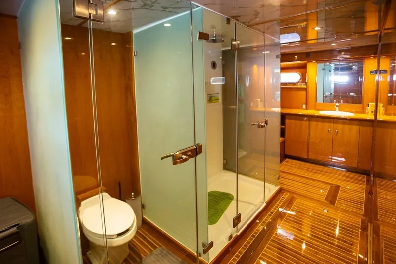 Alegre Yacht Photos Pics Luxurious bathroom on 2004 Symbol M.S Super 88 Motoryacht with glass shower and wooden finishes.