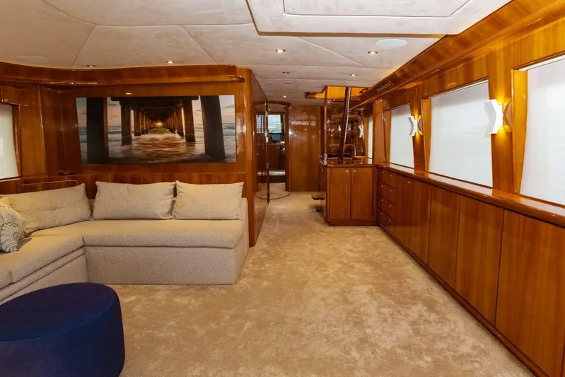 Alegre Yacht Photos Pics Luxurious interior of 2004 Symbol M.S Super 88 Motoryacht with elegant wood paneling and plush seating.