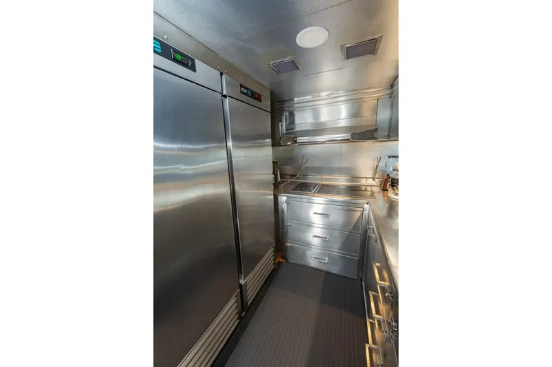 Alegre Yacht Photos Pics Stainless steel kitchen in 2004 Symbol M.S Super 88 Motoryacht, featuring modern appliances.