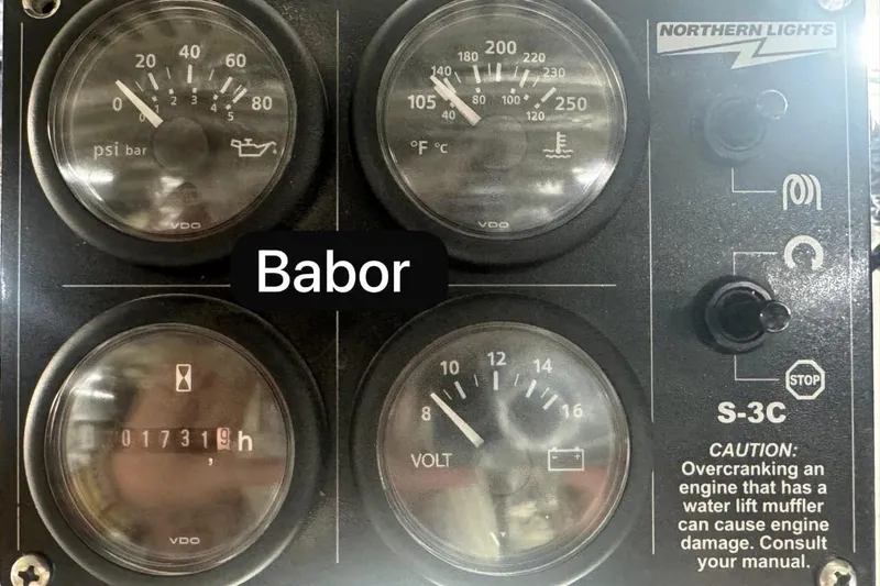 Alegre Yacht Photos Pics Control panel of a 2004 Symbol M.S Super 88 Motoryacht with gauges and caution label.