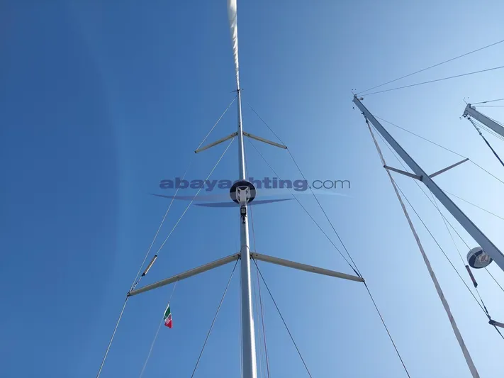  Yacht Photos Pics Masts of a 2011 Beneteau Sense 50 sailboat against a clear blue sky.