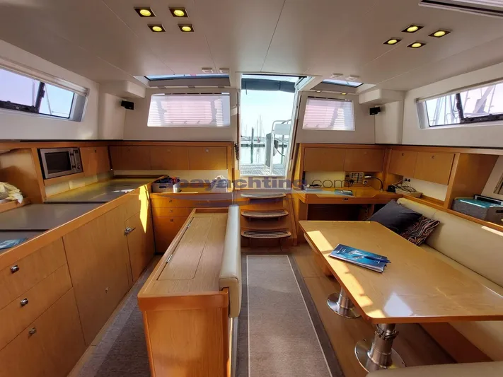  Yacht Photos Pics Interior of 2011 Beneteau Sense 50 yacht with modern wood finish and ample natural light.