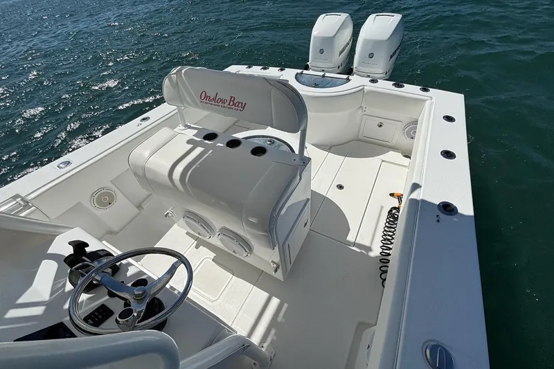  Yacht Photos Pics 2016 Onslow Bay 27 XS boat interior with dual engines on open water.