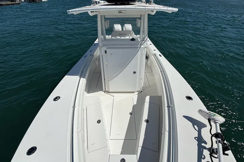  Yacht Photos Pics 2016 Onslow Bay 27 XS boat on water, showcasing sleek design and spacious deck.