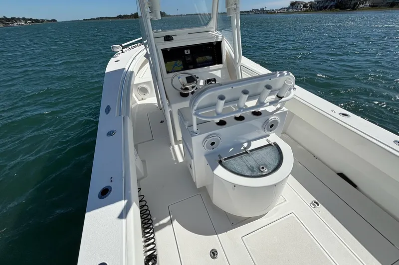  Yacht Photos Pics 2016 Onslow Bay 27 XS boat on water, featuring center console and rod holders.