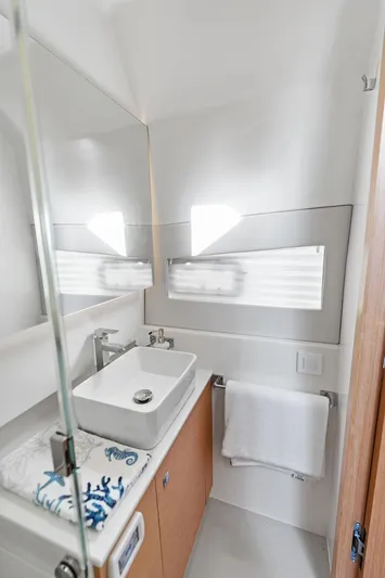  Yacht Photos Pics Modern bathroom in 2025 Makai M37 yacht with sleek sink and towel rack.