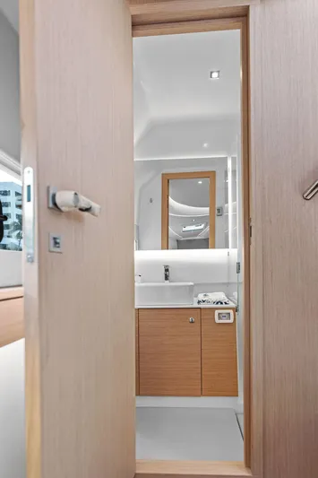  Yacht Photos Pics Modern bathroom interior in 2025 Makai M37 yacht, featuring sleek wood finishes and contemporary design.