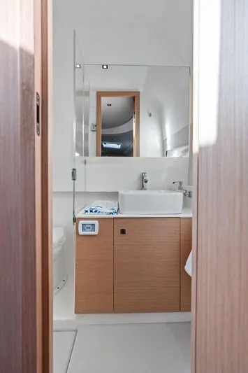  Yacht Photos Pics Modern bathroom interior in 2025 Makai M37 yacht, featuring sleek design and wooden cabinetry.