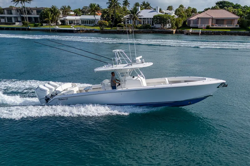 Irish Exit Yacht Photos Pics 2016 Bahama boat with Mercury V10 engines cruising on a scenic waterway.