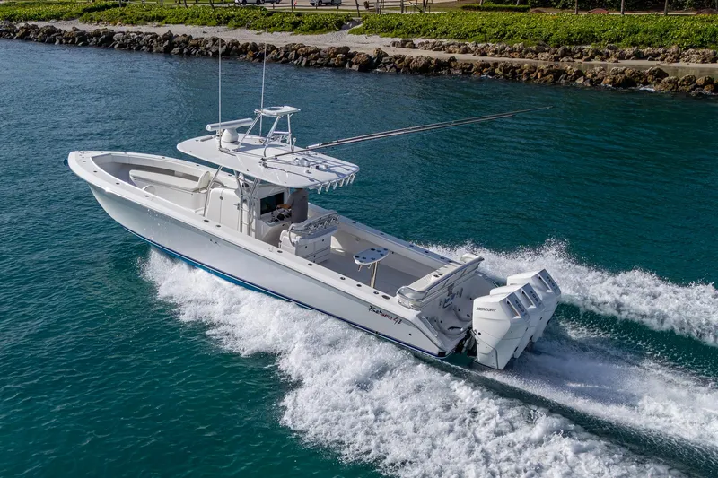 Irish Exit Yacht Photos Pics 2016 Bahama boat with Mercury V10 engines cruising on clear blue water.