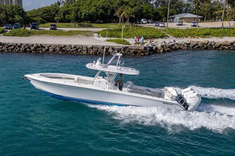 Irish Exit Yacht Photos Pics 2016 Bahama boat with Mercury V10 engines cruising on clear blue water.
