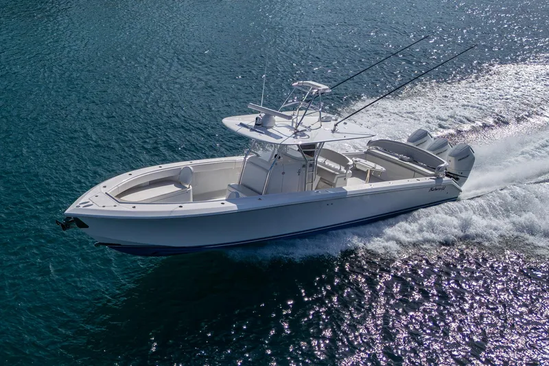 Irish Exit Yacht Photos Pics 2016 Bahama boat with Mercury V10 engines cruising on clear blue water.