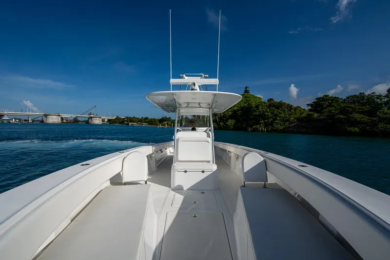 Irish Exit Yacht Photos Pics 2016 Bahama boat with Mercury V10 engines cruising on clear blue water.