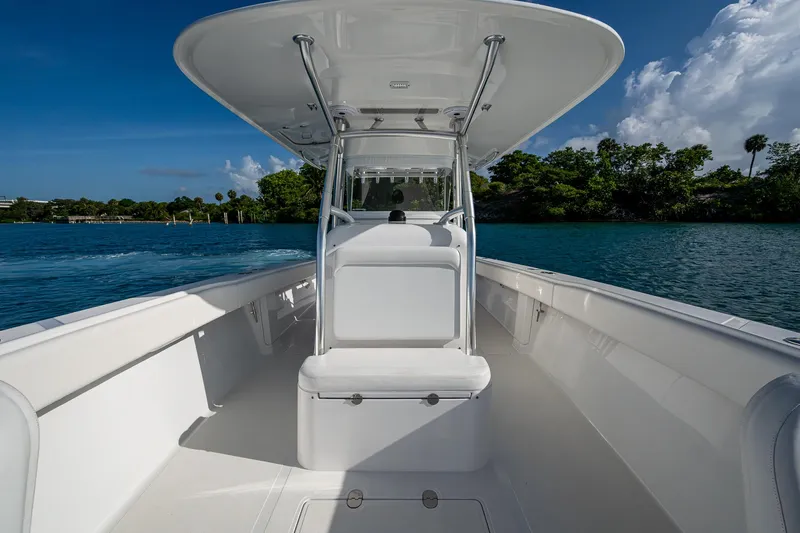 Irish Exit Yacht Photos Pics 2016 Bahama boat with Mercury V10 engines, sleek design, cruising on clear blue water.