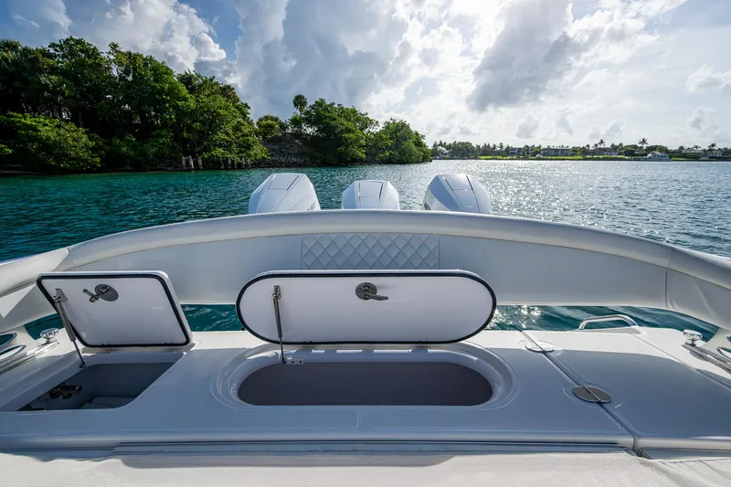 Irish Exit Yacht Photos Pics 2016 Bahama boat with Mercury V10 engines, open storage compartments, scenic water view.