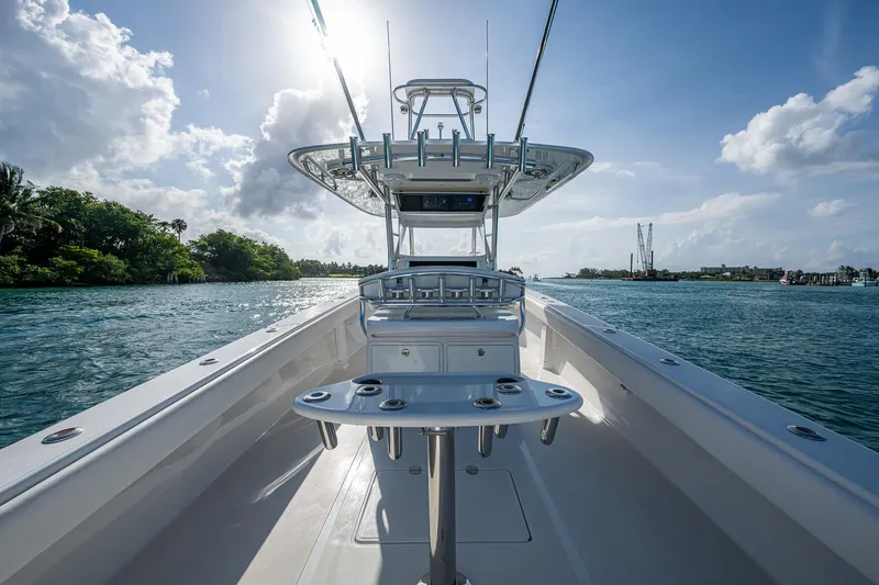 Irish Exit Yacht Photos Pics 2016 Bahama boat with Mercury V10 engines on a sunny day, cruising through clear waters.