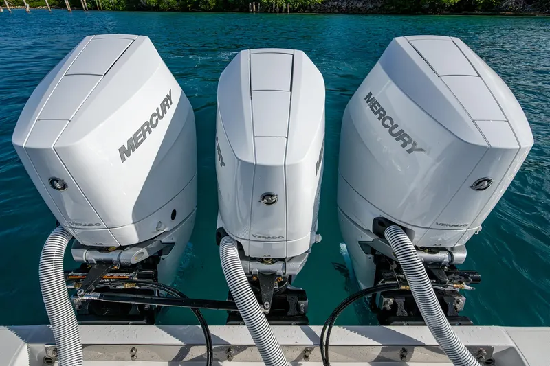 Irish Exit Yacht Photos Pics Three Mercury V10 outboard engines on a 2016 Bahama boat, docked on clear blue water.