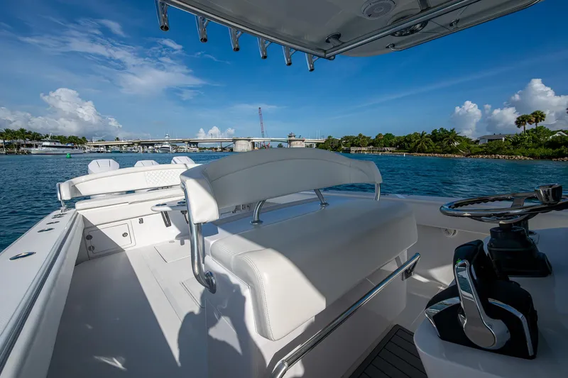 Irish Exit Yacht Photos Pics 2016 Bahama boat with Mercury V10 engines, featuring sleek white seating and controls, on a sunny day.