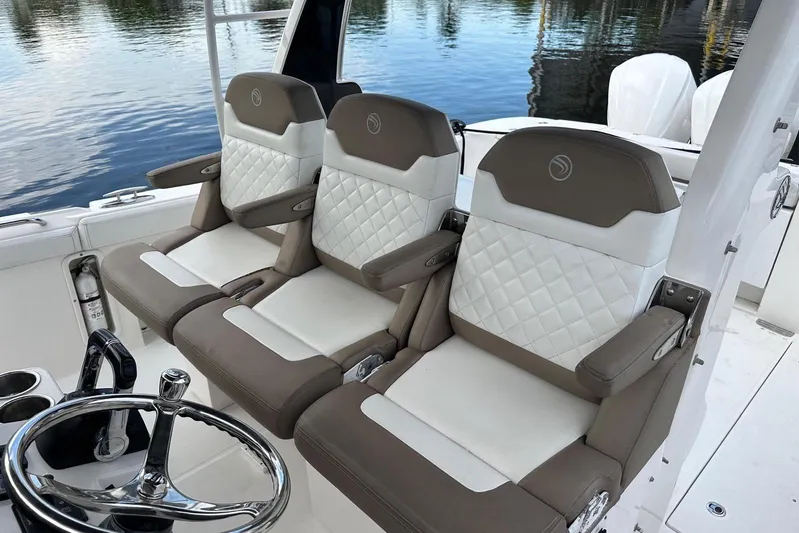  Yacht Photos Pics Luxurious seating on 2017 Edgewater 368CC boat, featuring elegant design and premium materials.