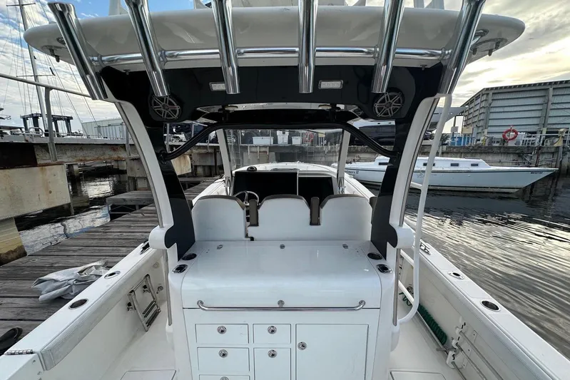  Yacht Photos Pics 2017 Edgewater 368CC boat docked at marina, showcasing spacious deck and seating area.