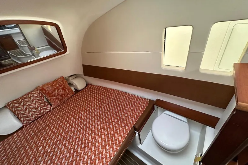  Yacht Photos Pics 2017 Edgewater 368CC cabin interior with bed and compact bathroom.