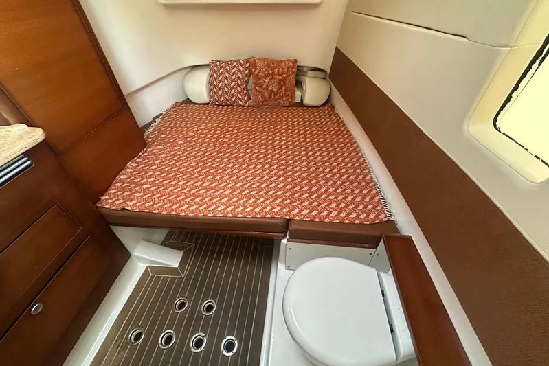  Yacht Photos Pics 2017 Edgewater 368CC cabin interior with bed, wooden cabinetry, and compact toilet.