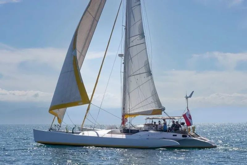 Koa E Kea Yacht Photos Pics Sailing catamaran "Pinta Exception 53" from 1986 on open sea with full sails.