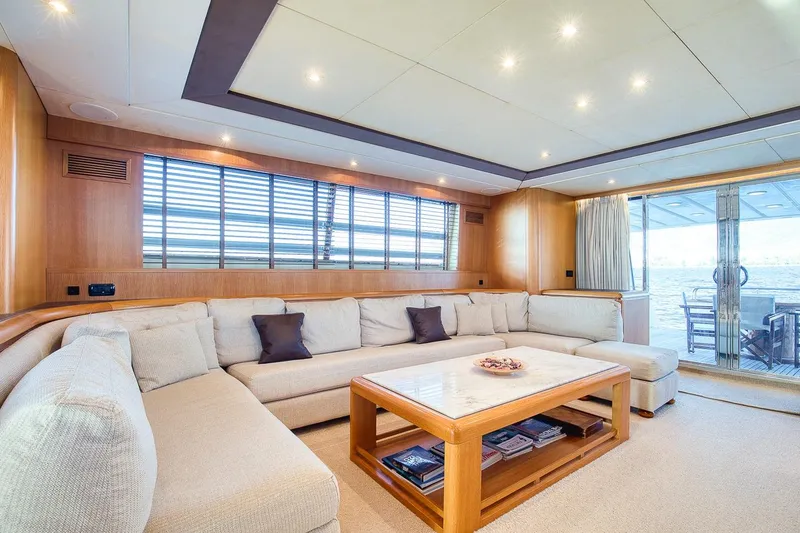 D-force Yacht Photos Pics Luxurious interior of 1998 Falcon Yachts 86 with spacious seating and elegant decor.