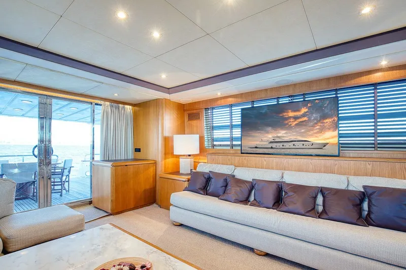 D-force Yacht Photos Pics Luxurious interior of 1998 Falcon Yachts 86, featuring elegant seating and large windows.