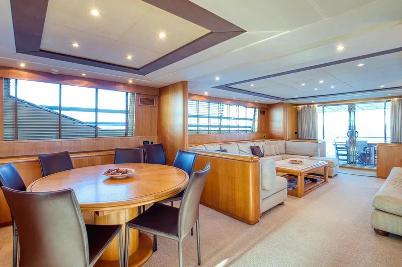D-force Yacht Photos Pics Luxurious interior of 1998 Falcon Yachts 86, featuring elegant dining and seating areas.