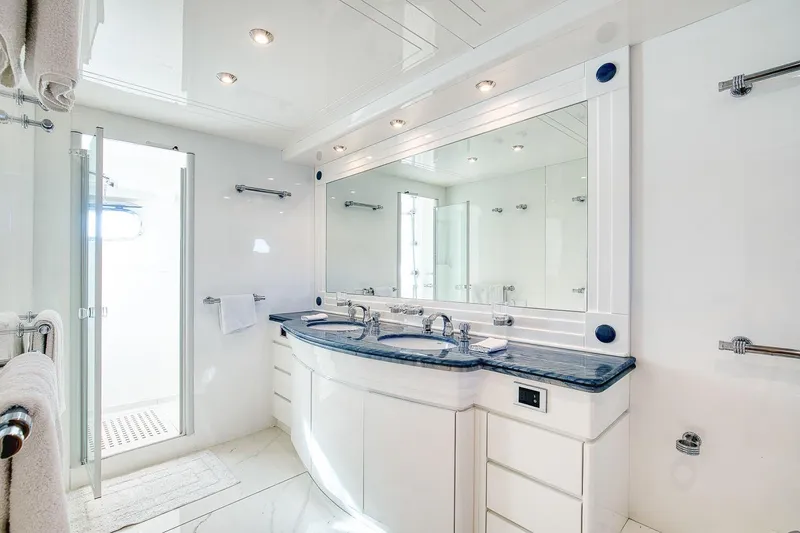 D-force Yacht Photos Pics Luxurious bathroom in 1998 Falcon Yachts 86, featuring dual sinks and modern fixtures.