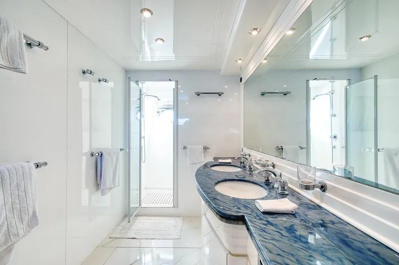 D-force Yacht Photos Pics Luxurious bathroom on 1998 Falcon Yachts 86, featuring dual sinks and elegant design.