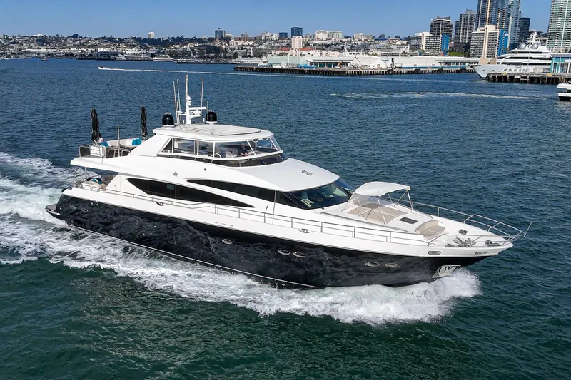 Sweeter T Yacht Photos Pics 2011 Princess 95 Motor Yacht cruising in a vibrant city harbor.