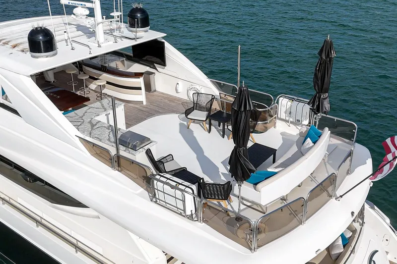 Sweeter T Yacht Photos Pics Luxurious 2011 Princess 95 Motor Yacht with spacious deck and seating area on the water.