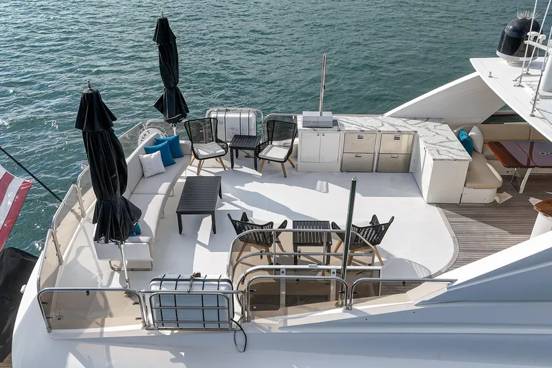 Sweeter T Yacht Photos Pics Luxurious deck of 2011 Princess 95 Motor Yacht with seating and dining area.